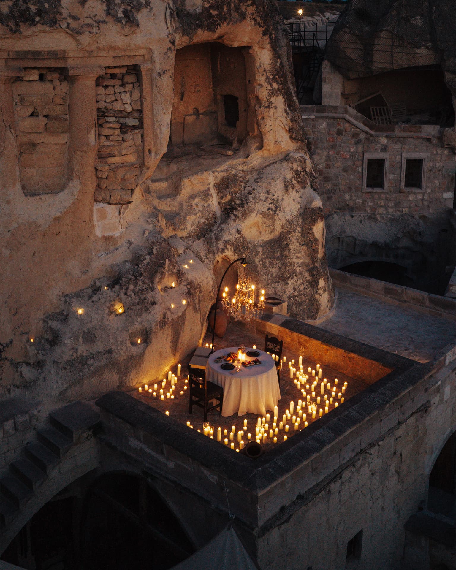 The candlelit cave terrace at night